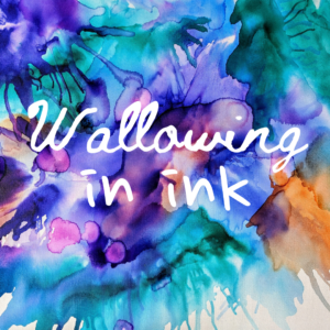 A colorful background of blue, green, purple and orange inks with the words Wallowing in Ink in a cursive hand